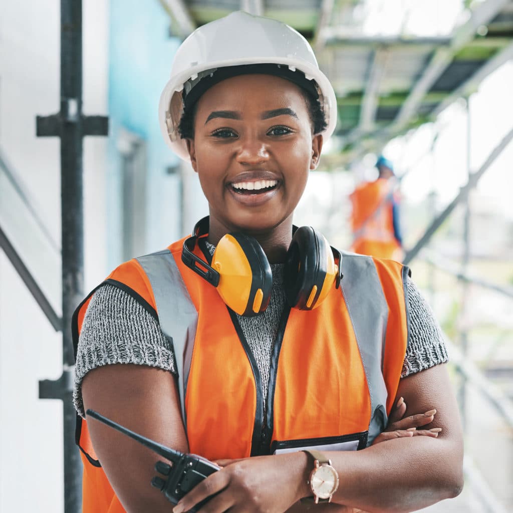 Young woman working at a construction site